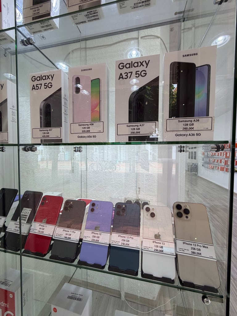 Display case showing Samsung Galaxy smartphones including A57 5G and A37 5G models in various colors with price tags